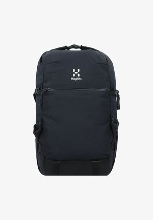 Sac à dos noir avec une texture lisse, doté d'une poignée supérieure, d'une poche zippée à l'avant, d'une poche en mesh sur le côté et d'un logo à l'avant.