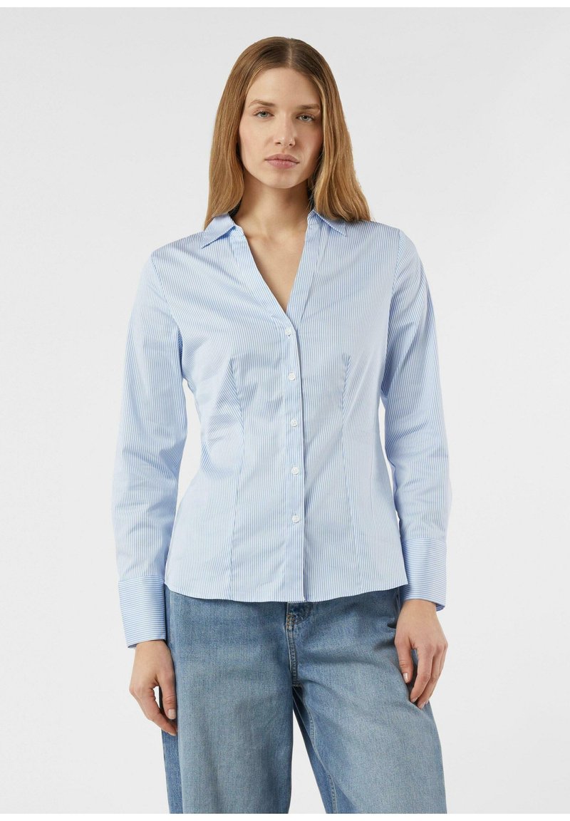 Light blue striped button-up shirt with a collar, long sleeves, and fitted silhouette. Fabric appears smooth with a slight sheen.