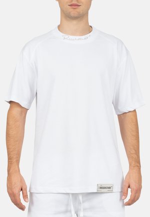 White short-sleeve t-shirt with a round neck, featuring embroidered logo at the collar and a fabric tag at the hem. Smooth texture.