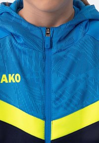 JAKO FUSSBALL-TEAM ICONIC KAPUZEN - Sweatjacke - blaugelb