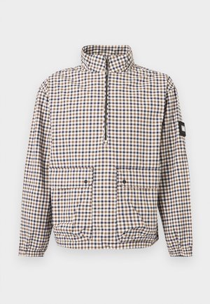 Μακρυμάνικο καρό μπουφάν με καφέ, μπλε και λευκά τετράγωνα, μπροστινό φερμουάρ μέχρι τη μέση, δύο τσέπες με καπάκι, ελαστικές μανσέτες και στρίφωμα.