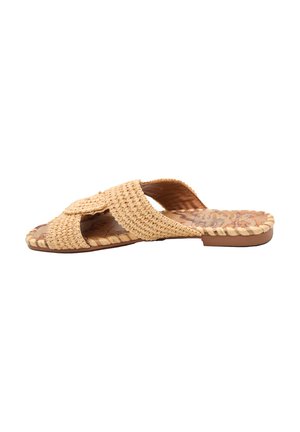 Infradito in paglia intrecciata color beige chiaro, con cinturini incrociati e una suola piatta con dettaglio della soletta testurizzata.
