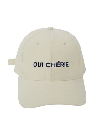 Beige Baumwollkappe mit gebogenem Schirm, vorne mit marineblauem, gesticktem Text "OUI CHÉRIE". Verstellbarer Riemen hinten.