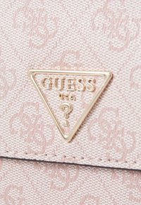 Guess ERICA FLAP - Cross body bag - dusty rose logo