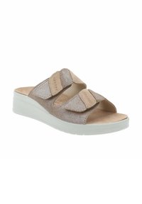 Sandali con tacco a cuneo beige, dotati di due cinturini regolabili in Velcro, parte superiore testurizzata e una soletta imbottita. Suola leggera in gomma bianca.