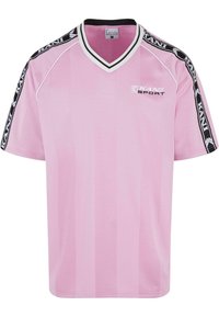 Pink sports jersey with a v-neck design and black shoulder accents. Features “KANI SPORT” logo in white on the front. Made from breathable fabric.