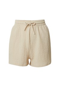 Beige textuurshorts met een elastische tailleband en trekkoord. De stof heeft een gekreukt patroon en is tot halverwege de dij leng.