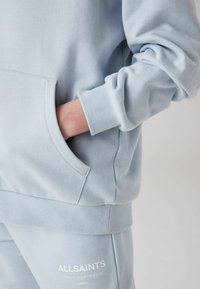 smALLSAINTS UNDERGROUND - Felpa con cappuccio - light blue