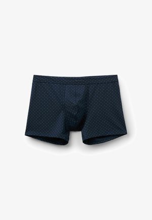 Pánské boxerky tmavě modré barvy s malými bílými puntíky, elastickým pasem a předním tvarovaným pytlíkem, zobrazené na bílém pozadí.