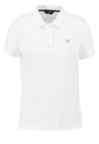 Vit polo-shirt i bomull med klassisk krage, tre knappar och en liten broderad logotyp på vänster bröst.