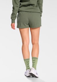 Hummel ACTIVE CO  - Träningsshorts - sea spray