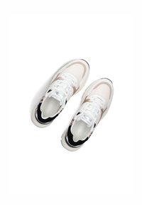 Sneakers with a white mesh upper, beige accents, black heel, and a patterned design. Features white laces and a cushioned sole.