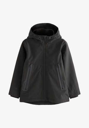 Veste noire à capuche avec fermeture éclair frontale, deux poches latérales zippées et cordons de serrage réglables sur la capuche.