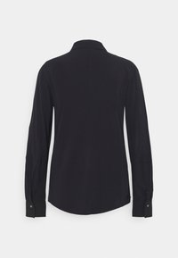 Camicia nera a maniche lunghe con colletto, orlo arrotondato e polsini con bottoni. Realizzata in un tessuto morbido e leggero.