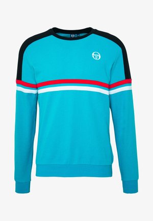 Sweat-shirt turquoise à manches longues avec des panneaux d'épaule noirs, des rayures horizontales rouges et blanches, et un petit logo blanc sur la poitrine gauche.