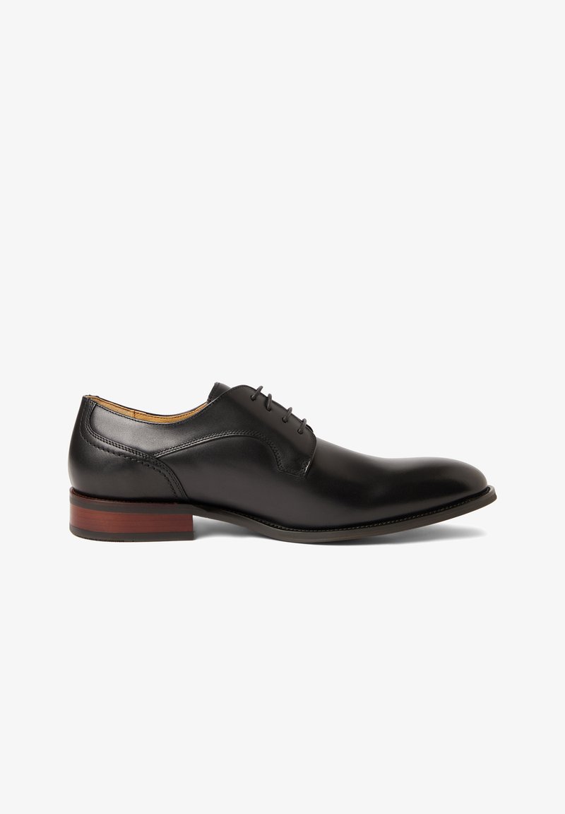 Black leather men's dress shoe with closed lacing, featuring a brown stacked heel and smooth polished finish, shown in side profile.