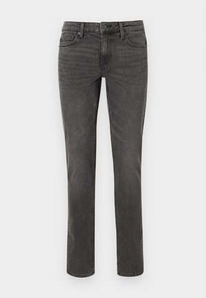 Grå denimjeans med rette ben, sømdetaljer, fem lommer og metallknapp for lukking i livet.