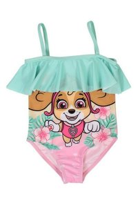 Un maillot de bain pour enfants avec un haut froncé vert menthe, un bas rose et un personnage de chien de dessin animé entouré de fleurs tropicales.