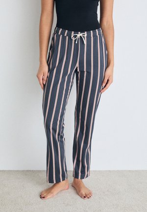 Striped pajama pants in navy and light pink. Soft fabric, elastic waistband with drawstring. Straight leg design, finished hem.
