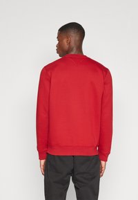 Tommy Jeans REGULAR C NECK - Sweatshirt - magma red