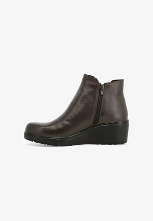 Stivaletto in pelle marrone scuro con cerniera laterale e suola in gomma nera, mostrato in profilo destro su uno sfondo bianco.