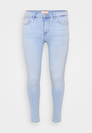 Light blue skinny jeans made of denim. Features front pockets and a zip fly with button closure. Smooth texture and tapered leg design.