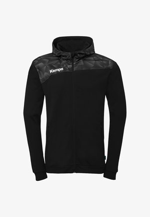Black full-zip hooded jacket with geometric patterned shoulder yoke and "Kempa" logo on the right chest.