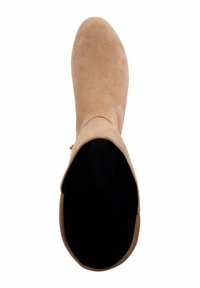 Beige suede ankle boot with a smooth finish, tapered toe, and fitted silhouette. Inside is lined in black material. Zipper detail on the side.