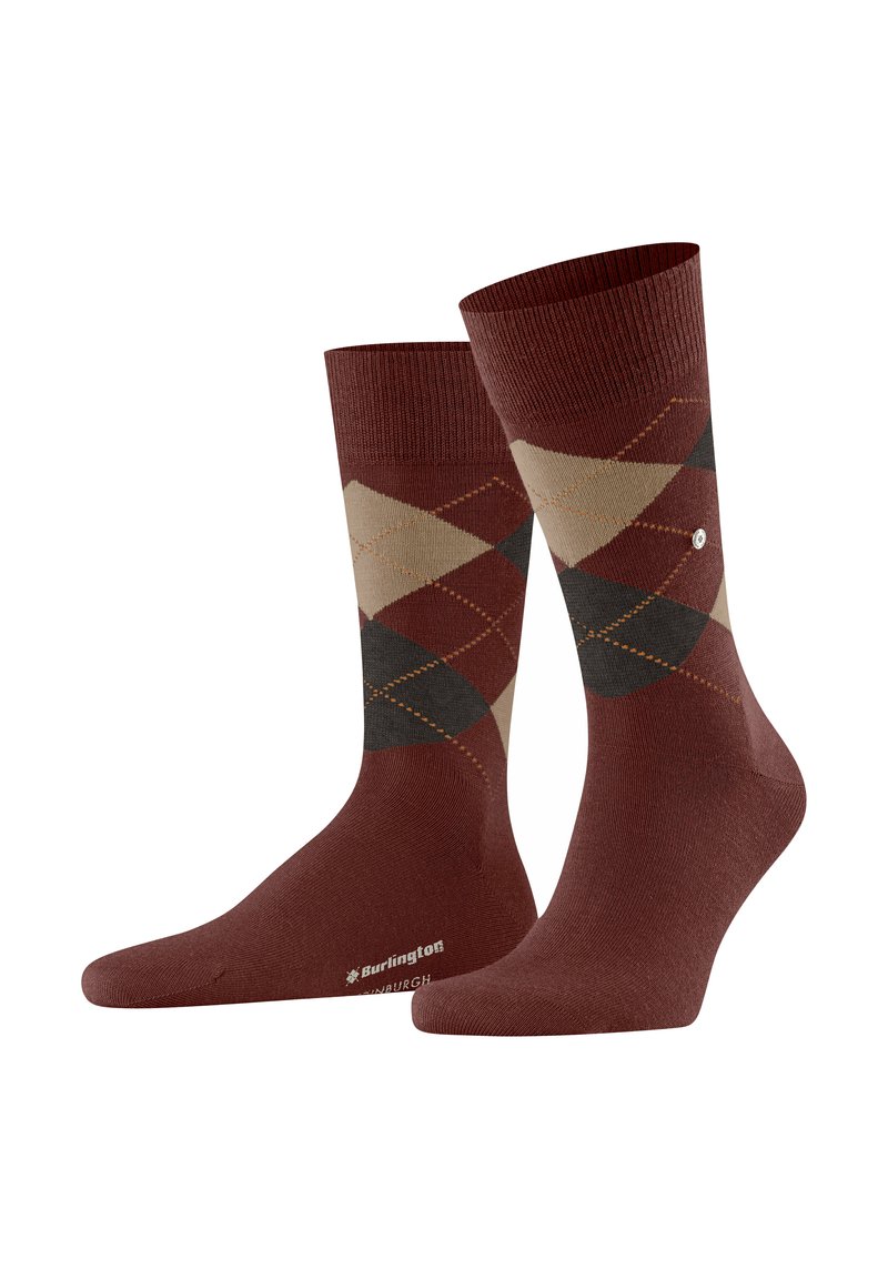 Un par de calcetines marrones hasta la mitad de la pantorrilla con un patrón de argyle en beige y gris oscuro, y costuras naranjas, que presentan un pequeño logo cerca del puño.
