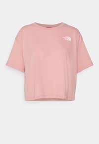 Lichtroze kortemouw crop t-shirt van katoen, met een wit logo op de bovenste linkerkant van de borst en een ronde hals.
