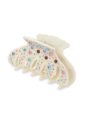 Plastic hair clip in cream with four claws, adorned with colorful rhinestones in pink, blue, and brown, featuring a smooth texture.