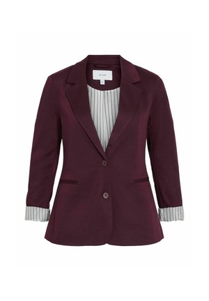 Blazer ajusté violet foncé avec deux boutons, revers crantés et poignets rayés repliés sur un doublure blanche.