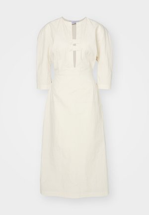 Krém színű, térdÍg érő ruha, szerény dekoltázzsal, háromnegyedes ujjakkal és két gombbal díszítve elöl. Texturált anyag, jól kidolgozott fazon.