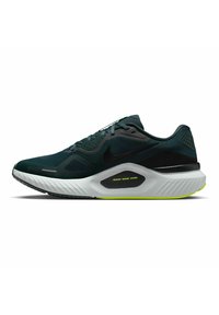 Scarpa sportiva da uomo con tomaia in mesh verde scuro, accenti neri, soletta bianca e dettagli verdi sulla suola con motivo di presa testurizzato.