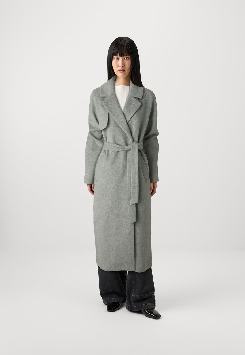 Gray wool wrap coat with a belt, lapel collar, long sleeves, double-breasted design, and hem falling below the knees. Black wide-leg pants underneath.