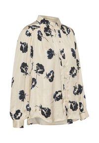 Cream-colored blouse made of smooth fabric, featuring a floral pattern in navy. It has a button-up front, collar, and long sleeves.