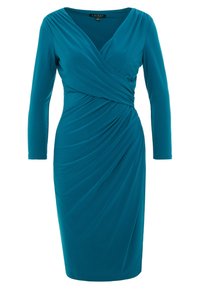 Teal, långärmad klänning med omslagdesign. Tillverkad av ett smidigt tyg, med draperade detaljer och en figurnära silhuett.