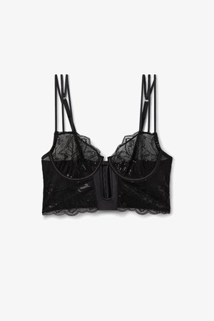 Zwarte bralette met ingewikkeld kant en sequentiedetails, verstelbare bandjes en een gegolfde rand. Zachte stof en gestructureerde cups.