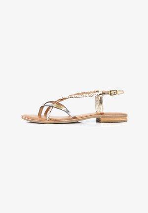 Metallic gold and silver flat sandals with braided and buckle details on a brown leather footbed and layered wooden heel.