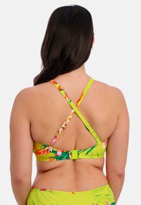 Bikini-top met bloemenpatroon in felgroen, voorzien van kruislingse bandjes en verstelbare sluitingen op de rug voor een veilige pasvorm.