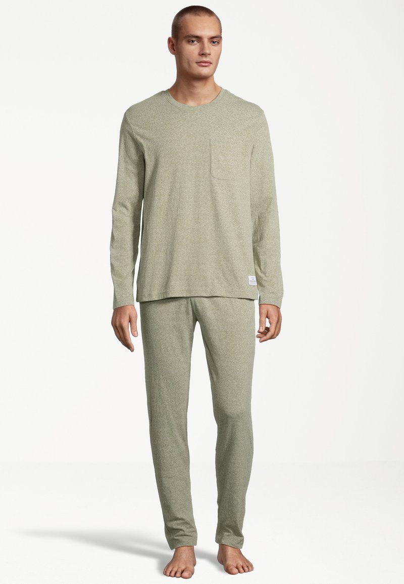 Light green, long-sleeve pajama set made from soft fabric; features a chest pocket on the top and slim-fit pants.