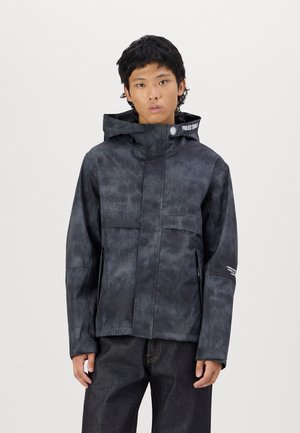 Black, waterproof jacket featuring a textured pattern, a hood, and front pockets. Includes branding on the collar and sleeve.