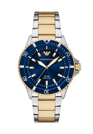 Herrenuhr aus zweifarbigem Gold- und Silbermetall mit blauem Zifferblatt, goldenen Markierungen, drehbarer Lünette und solarbetriebener Wasserbeständigkeit bis zu 100 m.