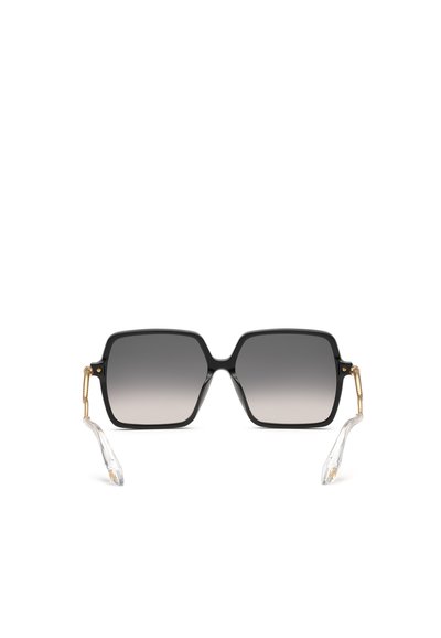 Lunettes de soleil carrées noires avec verres foncés dégradés et détails dorés sur les branches, se terminant par des embouts incurvés transparents.