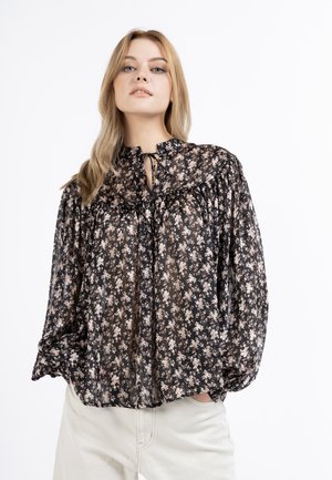 Black sheer blouse with floral print, pleated design, high neck with tie closure, and puffy sleeves. Light and textured fabric.