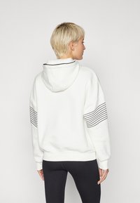 Mizuno ATHLETICS HOODY - Majica s kapuljačom - pristine