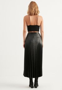 Herita Plooirok - black