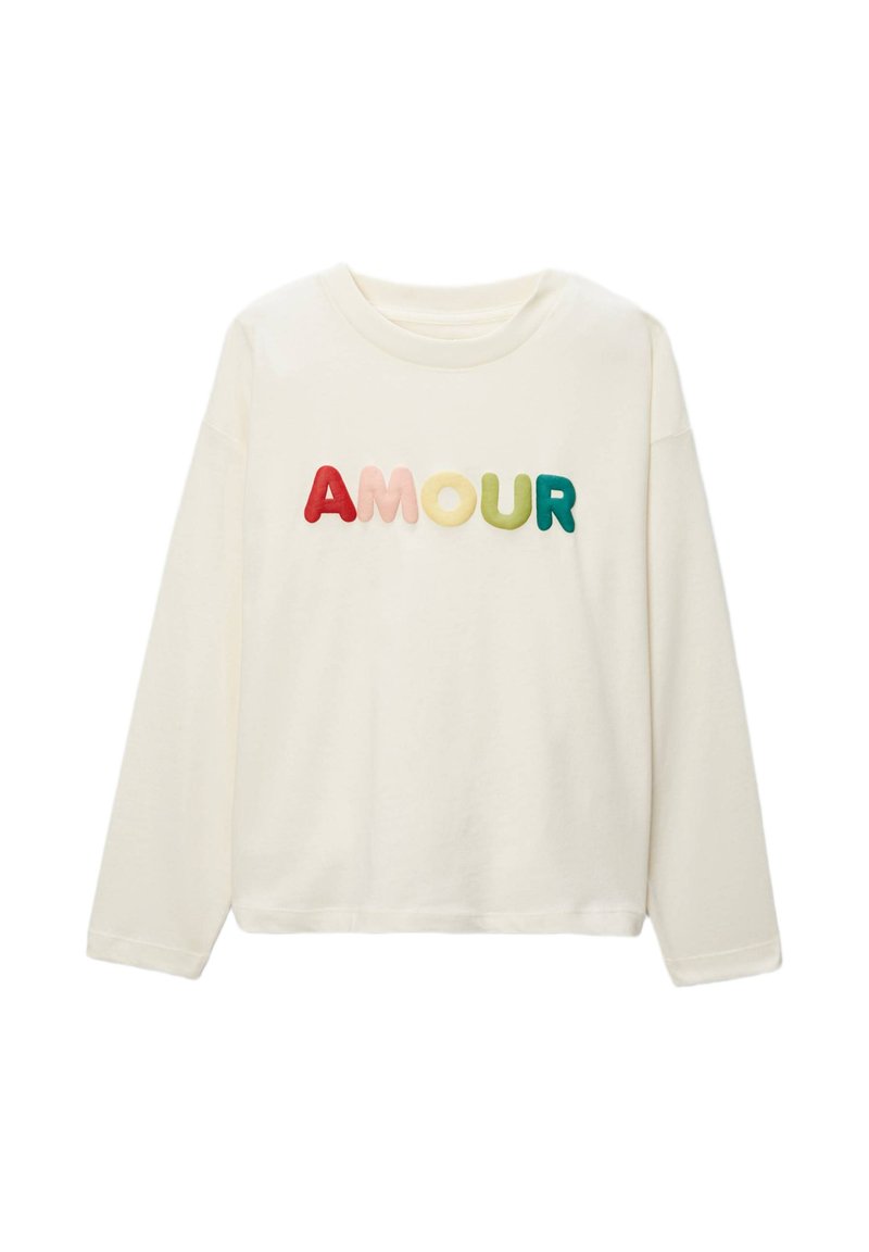 Chemise à manches longues crème avec le mot "AMOUR" en relief et multicolore en tissu doux. Coupe décontractée avec un col rond et sans coutures visibles.
