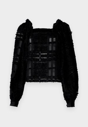 Zwart getextureerd langslivertop met transparante panelen en een vierkante halslijn. De stof combineert fuzzy en gladde elementen, wat zorgt voor visueel contrast.