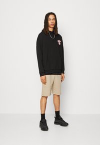 Alpha Industries X-FIT - Tepláky - vintage sand